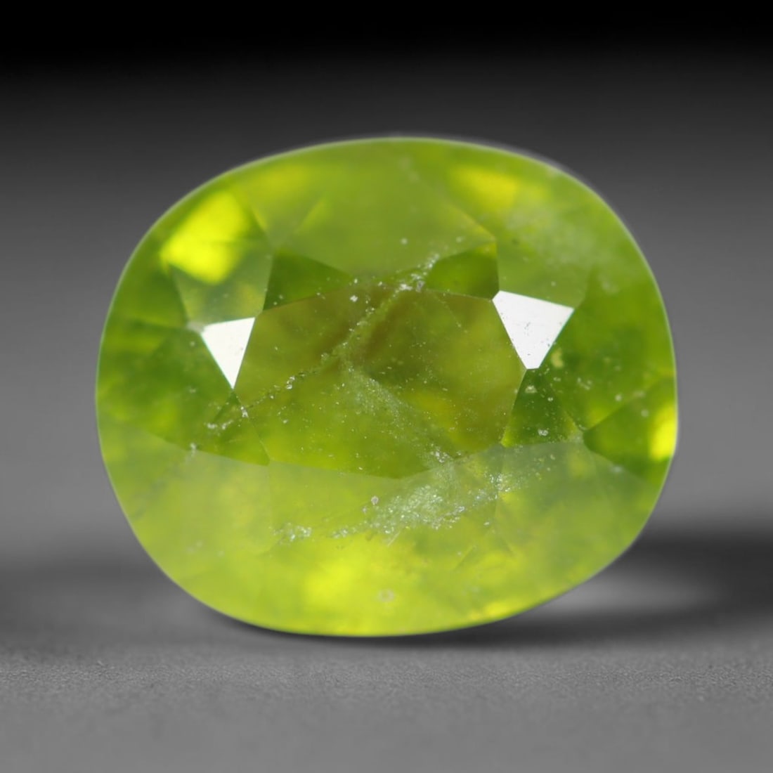 3.55ct Natural Mexican Lime Green Faceted Sphene Loose Gemstone, 53BA: This precisely faceted sphene exhibits vivid translucent lime green body tone, featuring fine natural mineral veils and tiny scattered crystalline micro-inclusions trapped within its high-refractive c