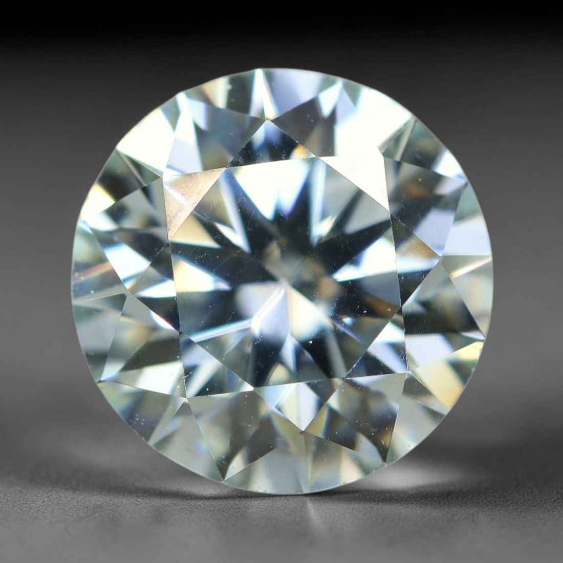 2.46 Carats Natural Cool White Moissanite Loose Gemstone, 28FL: This cool white moissanite holds dimension measurements of 9x5.4mm, delivering exceptional light dispersion that generates vivid rainbow sparkle across its fully transparent body, with faint microscop