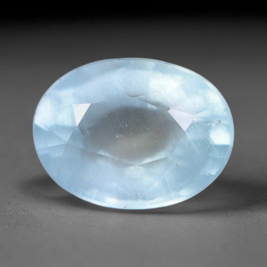 1.75ct Natural Brazilian Soft Sky Blue Faceted Aquamarine Loose Gemstone, 1AS: This expertly faceted aquamarine carries a gentle soft sky blue translucent body with faint fine natural internal mineral markings visible through its polished reflective facets within its 8.9x6.7x4.7