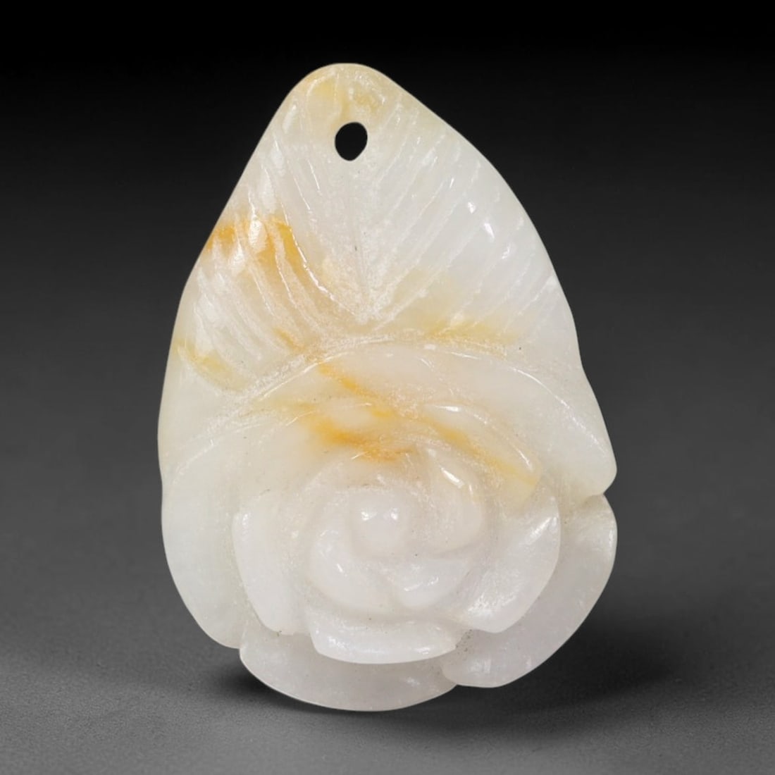 Natural Burmese Type A Jadeite Jade Hand Carved Pendant, 71BL: Artisan hand-carved untreated Burmese Type A jadeite jade pendant measuring 27x19 mm. Carefully sculpted with detailed relief craftsmanship and finished with a smooth glossy polish. Authentic Type A j