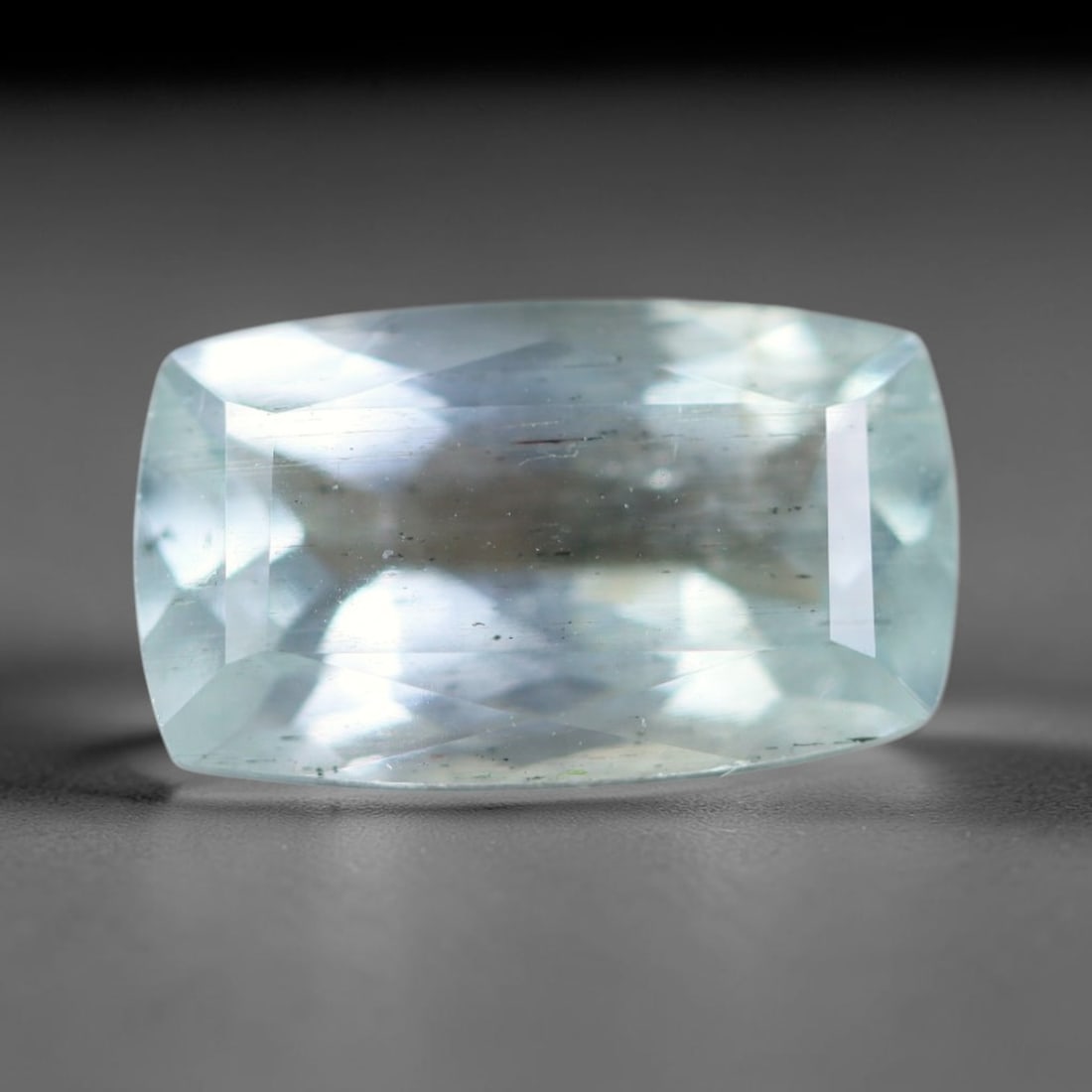 2.36ct Natural Brazilian Sky Blue Faceted Aquamarine Loose Gemstone, 6BC: This precisely faceted aquamarine boasts clear translucent pale sky blue body tone with subtle thin mineral needle and tiny scattered crystalline specks visible within its polished reflective planes i