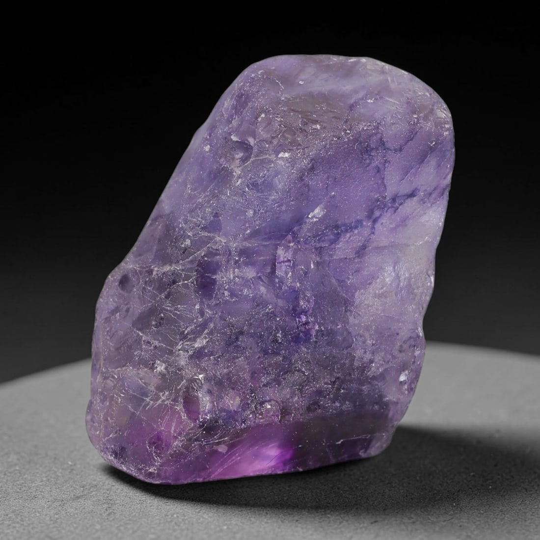 178ct Natural Chinese Deep Violet Purple Fluorite Rough, 11AT: This rugged fluorite rough boasts rich layered violet purple saturation blended with warm rust-colored mineral inclusions that streak its uneven raw surface, soft translucency lets light drift through