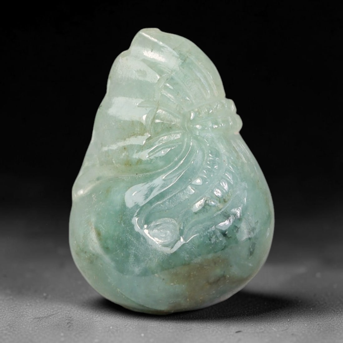 Natural Burmese Type A Jadeite Jade Hand Carved Pendant, 84BL: Artisan hand-carved untreated Burmese Type A jadeite jade pendant measuring 30x21 mm. Carefully sculpted with detailed relief craftsmanship and finished with a smooth glossy polish. Authentic Type A j
