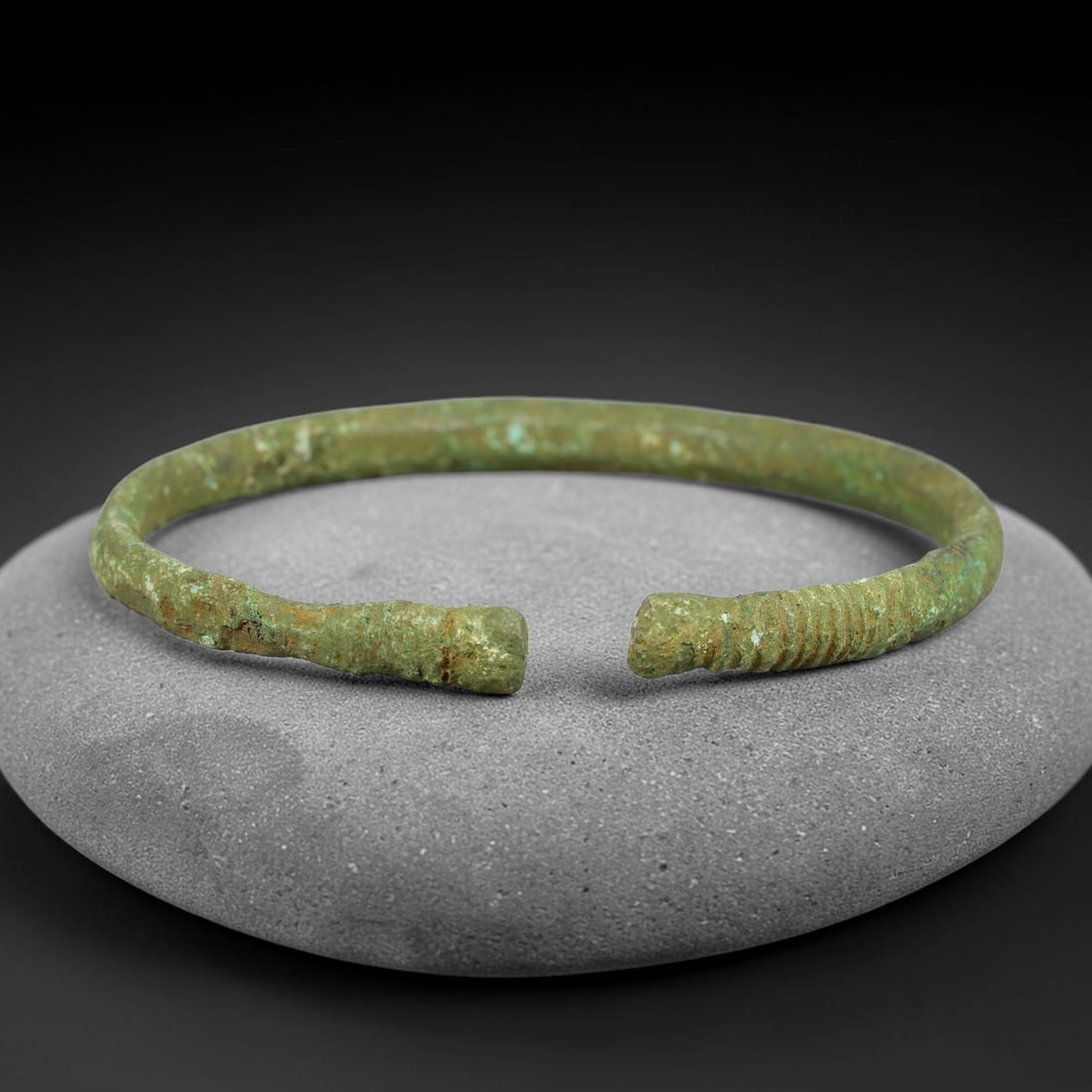 Ancient Roman Republic & Imperial Roman Bronze Open Armilla Bracelet (509 BCE-476 CE), 6AC: This antique solid bronze open cuff armilla bracelet originates from Roman Republic & Imperial Roman Culture, widely produced utilitarian and symbolic adornment worn by civilian women and awarded as m