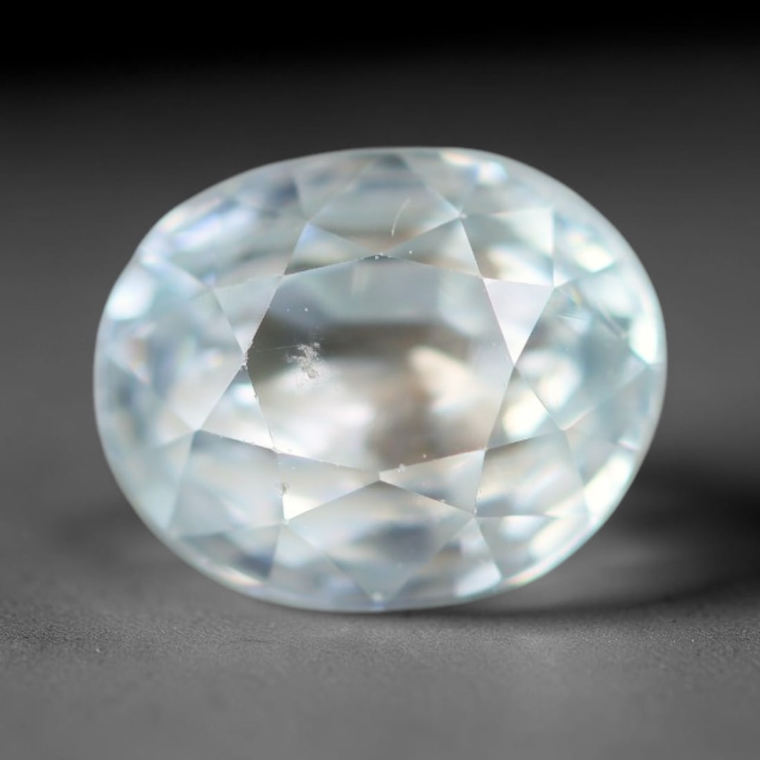 1.90ct Natural Cambodian Sky Blue Blue Zircon Loose Gemstone, 22BA: This fully polished blue zircon carries a gentle pale sky blue body tone with tiny microscopic mineral specks dispersed within its high-dispersion crystal interior, measured at calibrated dimensions o
