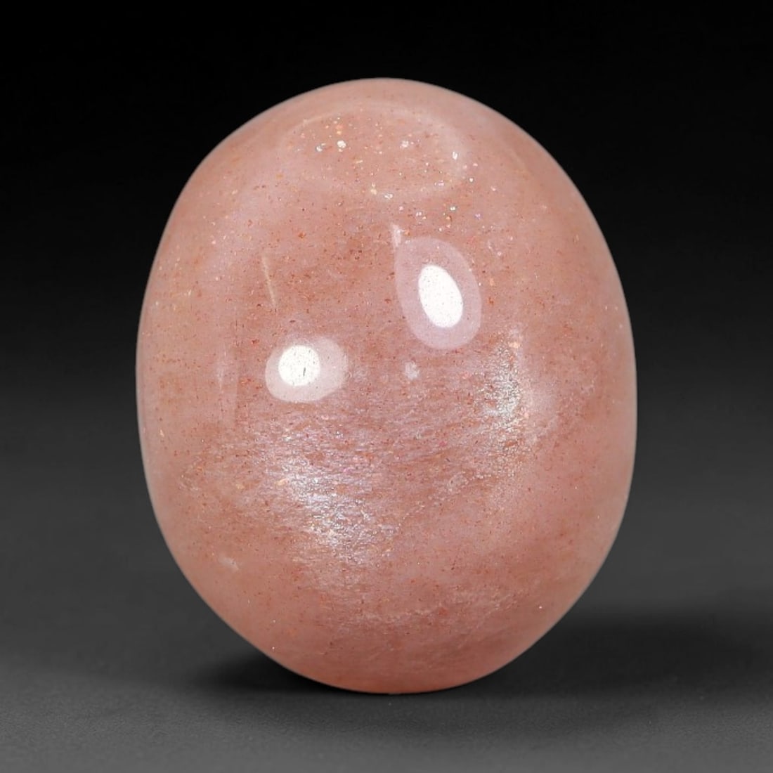 13.28 Carats Natural Ceylon Soft Peach Pink Moonstone Cabochon Loose Gemstone, 94AB: This warm soft peach pink moonstone features delicate sparkling mineral flecks scattered throughout its smooth surface paired with faint flowing adularescent glow, measured at 17.7x14.5x7.6mm, its gen