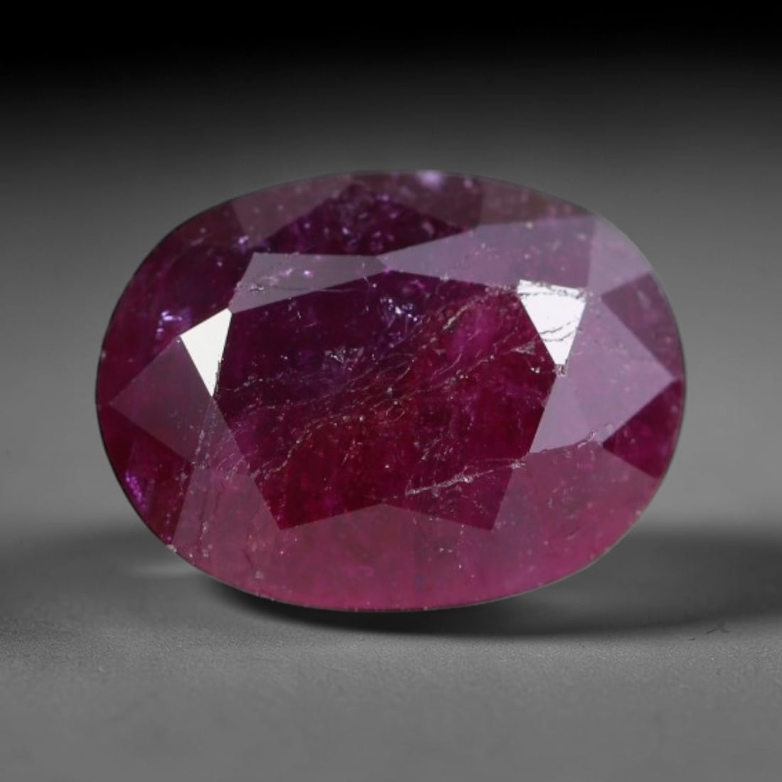 1.19ct Natural Tanzanian Longido Deep Crimson Red Faceted Ruby Loose Gemstone, 77BC: This expertly faceted Longido ruby features a rich deep crimson red body tone with distinct natural linear mineral striations, scattered pale mineral deposits and minor dark mineral flecks visible wit