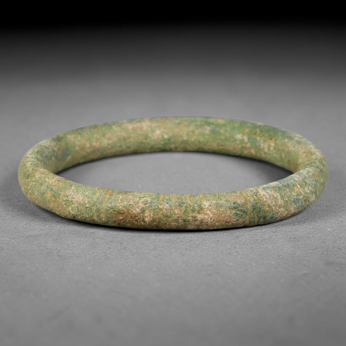 Ancient Roman Republic & Imperial Roman Bronze Incised Bangle Bracelet (509 BCE-476 CE), 94AT: This antique solid bronze closed circular bangle bracelet originates from Roman Republic & Imperial Roman Culture, popular personal adornment worn by provincial Roman civilians across the Mediterranea