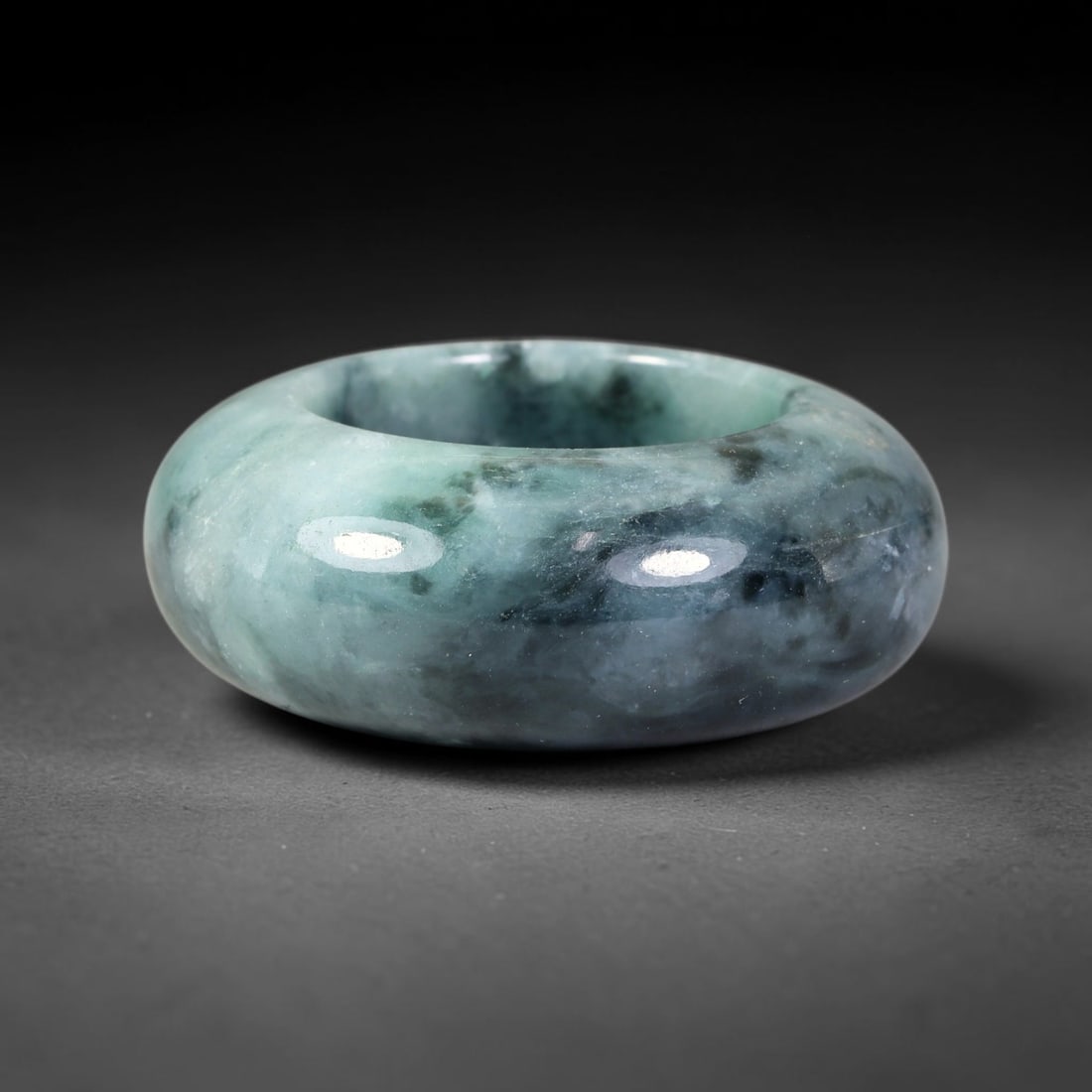 Natural Burmese Type A Jadeite Jade Wide Band Ring, 27BK: Polished untreated Burmese Type A jadeite jade wide band ring, US ring size 13 with a substantial band width of 13 mm. The jadeite features a soft pale mint green base naturally streaked with flowing 