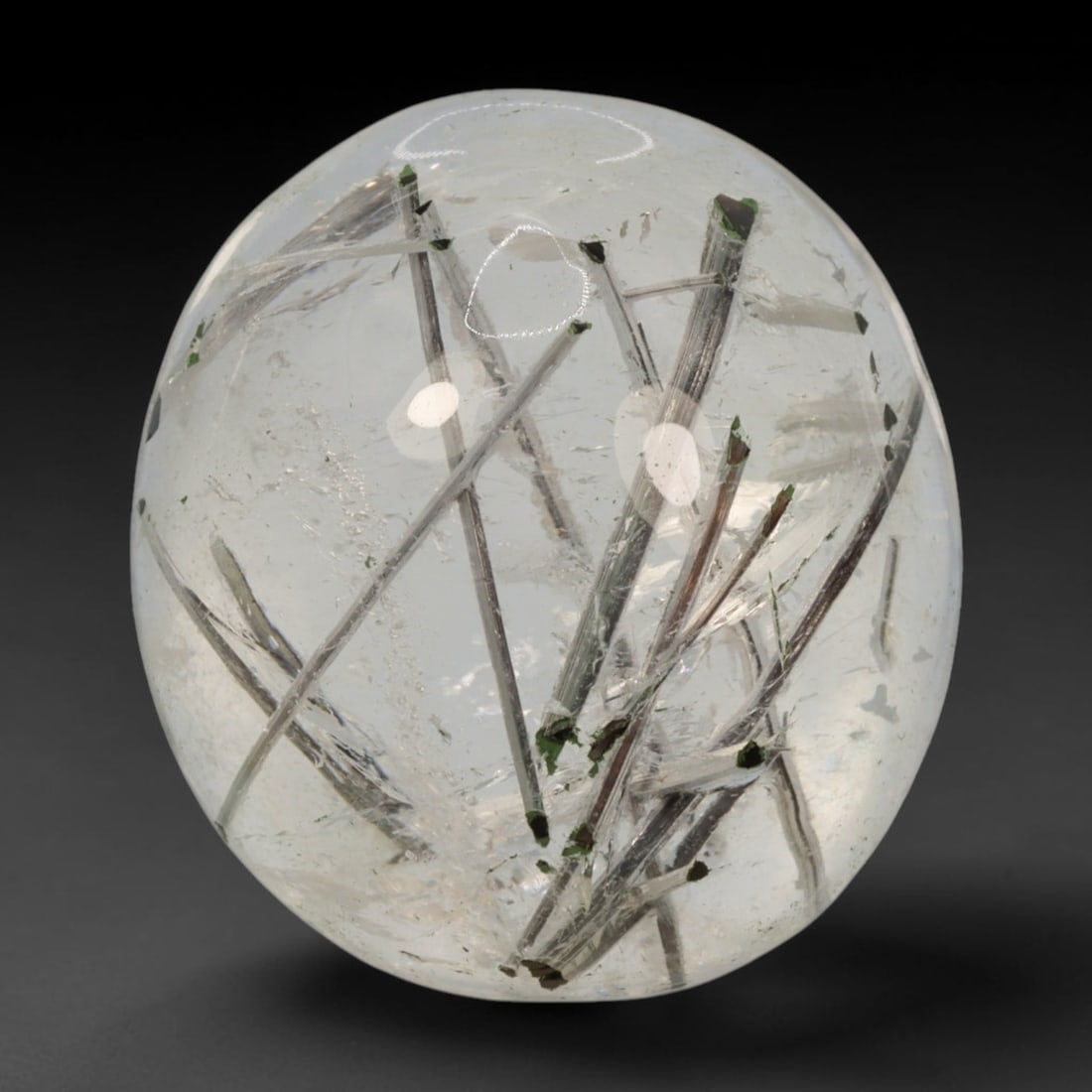 19ct Natural Brazilian Black Rutile Quartz Cabochon Loose Gemstone, 51BM: This polished cabochon of natural rutile quartz features countless distinct slender black rutile needle inclusions suspended within the clear quartz host crystal. The smooth domed surface enables full
