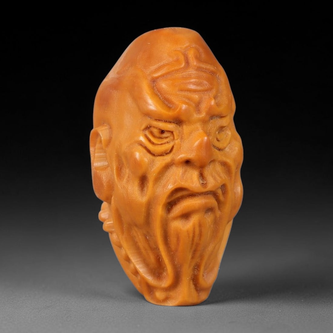 A Chinese Carved Natural Olive Nut Drilled Art Bead, 11BZ: Traditional craft bead carved from solid natural olive nut core, representing a classic miniature Chinese micro-carving folk art piece with a pre-drilled suspension bore integrated for easy threading 
