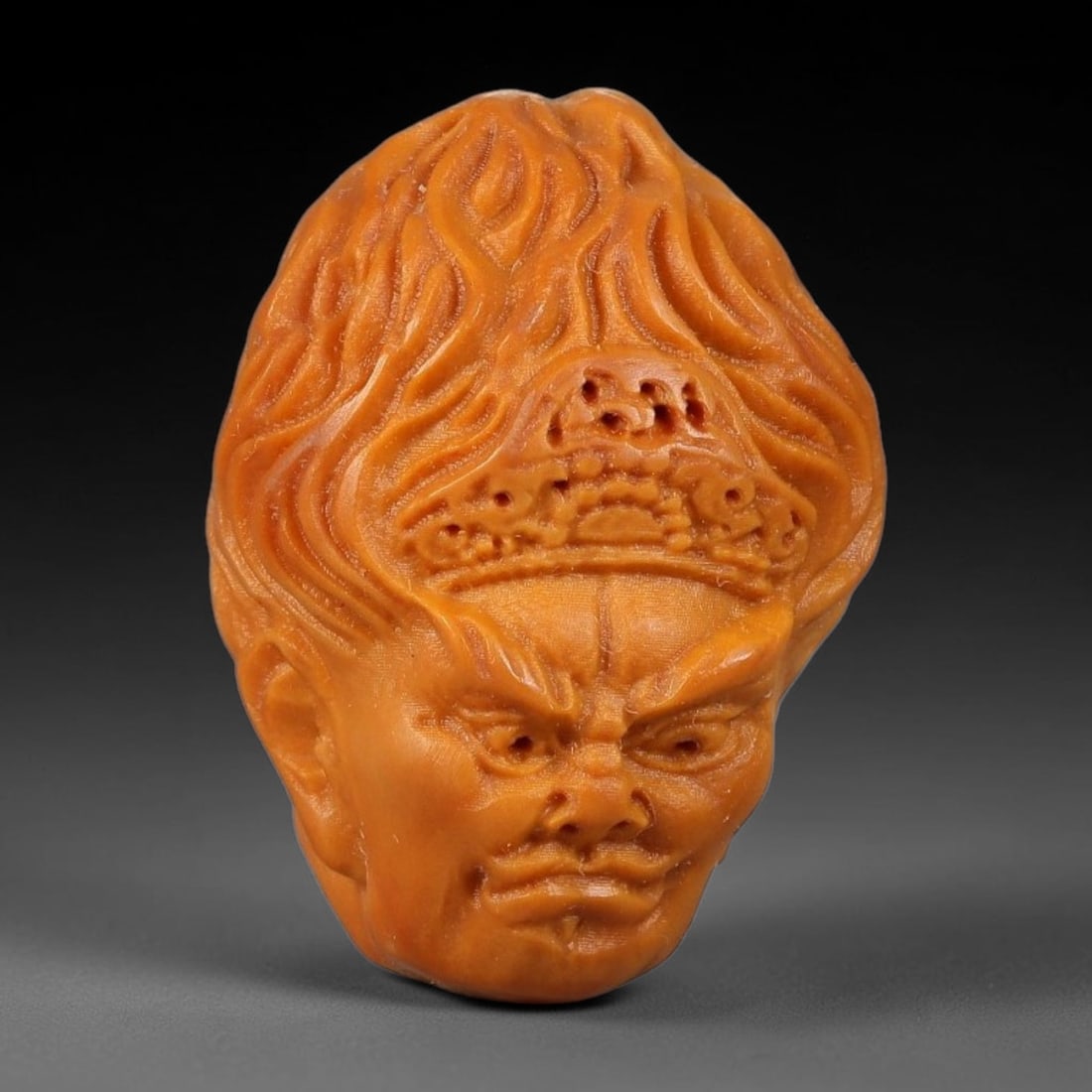 A Chinese Carved Natural Olive Nut Drilled Art Bead, 35BZ: Traditional craft bead carved from solid natural olive nut core, representing a classic miniature Chinese micro-carving folk art piece with a pre-drilled suspension bore integrated for easy threading 