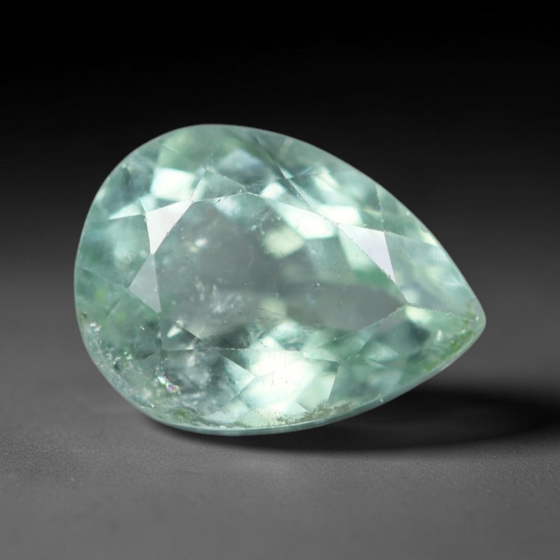 1.44 Carats Natural Mozambique Paraiba Color Tourmaline Loose Gemstone, 23AK: This transparent Mozambique tourmaline features bright Paraiba-style cool aqua-green body tone, filled with subtle natural fine mineral specks and faint native internal fissures throughout its crystal