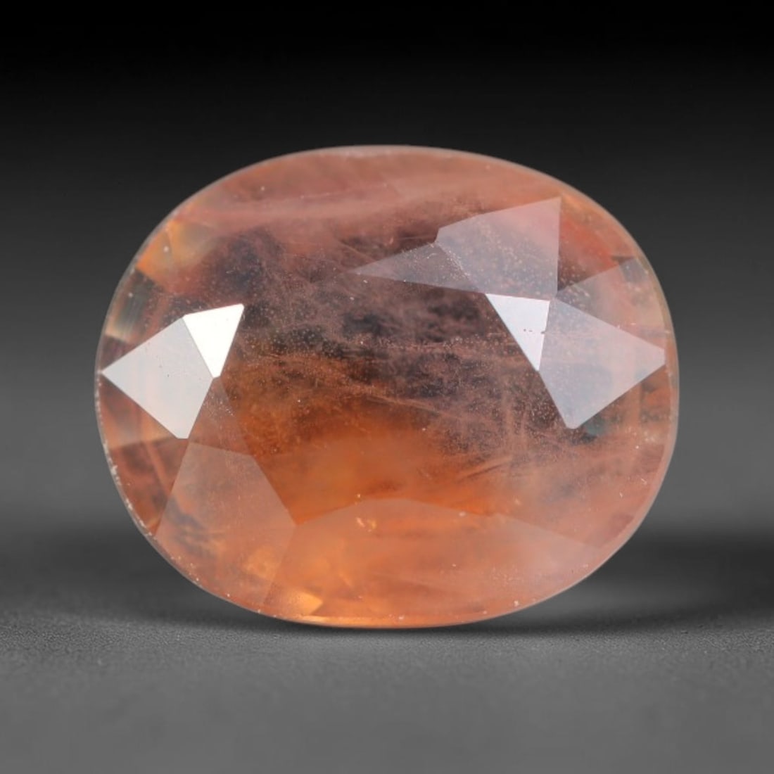 1.26ct Natural Sri Lankan Padparadscha Sapphire Loose Gemstone, 74BC: This fully polished Padparadscha sapphire carries warm blended peach-pink and soft orange body saturation, with subtle microscopic mineral flecks dispersed within its crystalline interior across its c
