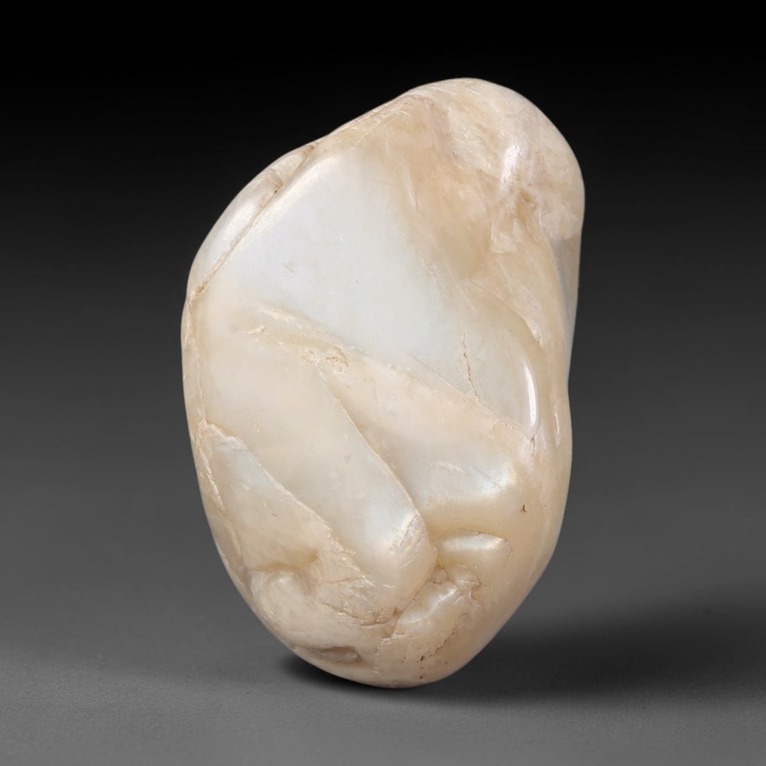 90ct Natural Ceylon Pale Cream White Moonstone Rough, 73AH: This smooth weathered moonstone rough carries soft pale cream white translucency with subtle internal silvery adularescent shimmer locked within its naturally tumbled surface, fine faint mineral veini