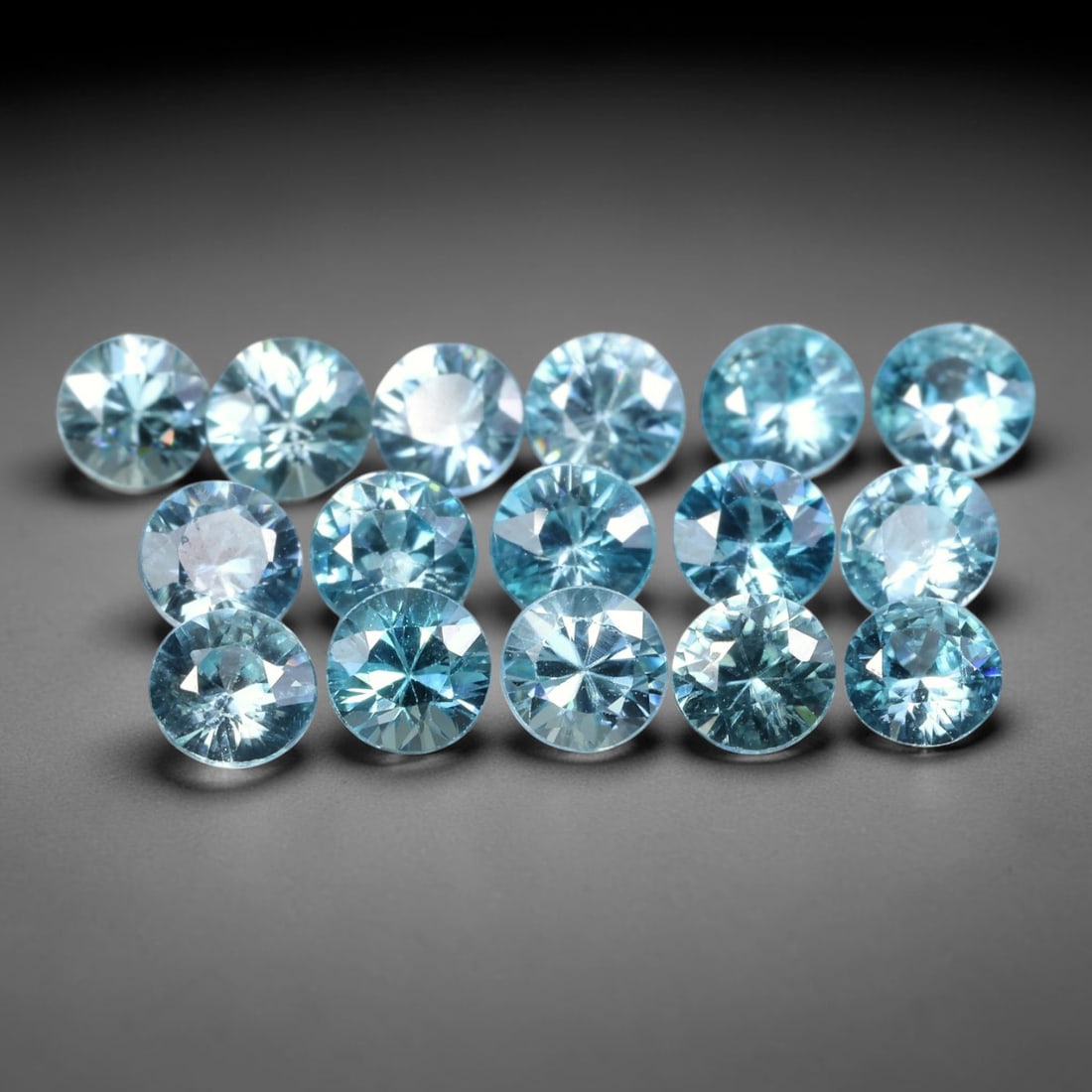 5.85ct Parcel of 16pcs Natural Brazilian Calibrated Round Sky Blue Topaz Loose Gemstones, 34BE: This matched parcel contains sixteen polished calibrated round topaz displaying clean bright sky-blue hue, with faint minor natural internal crystal features within each gemstone, uniform calibrated s