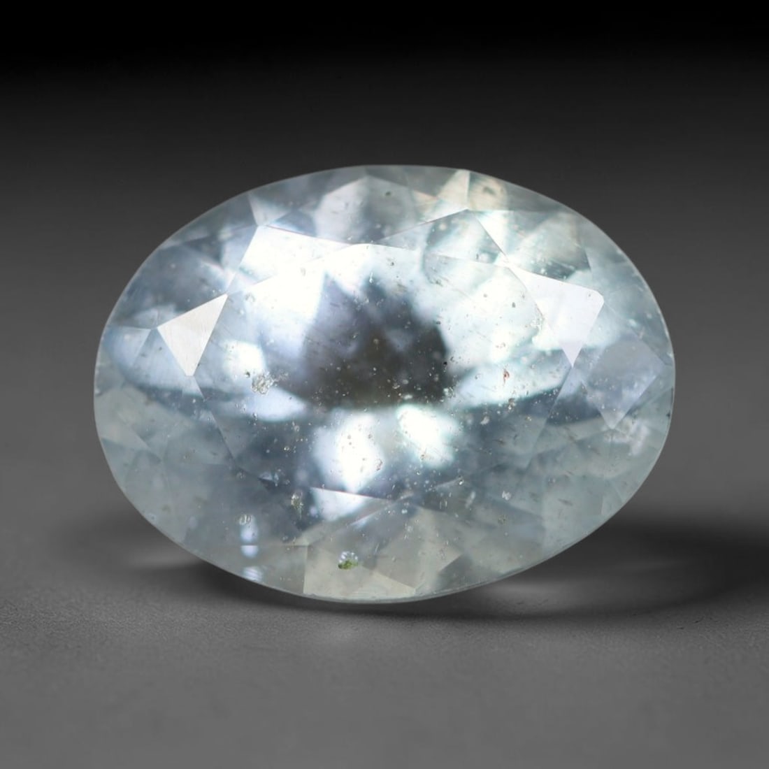 2.42ct Natural Brazilian Sky Blue Faceted Aquamarine Loose Gemstone, 22BC: This precisely faceted aquamarine boasts clear translucent pale sky blue body tone with subtle thin mineral needle and tiny scattered crystalline specks visible within its polished reflective planes i