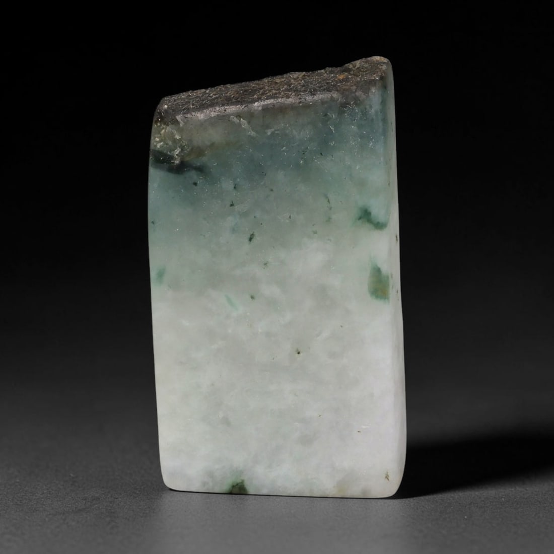 196ct Natural Type A Burmese Jadeite Jade Sliced Rough, 34FD: This specimen is a sliced rough block of natural Type A Burmese jadeite jade. The interior displays natural colour zoning with visible mineral veining and crystalline patterns typical of unprocessed j