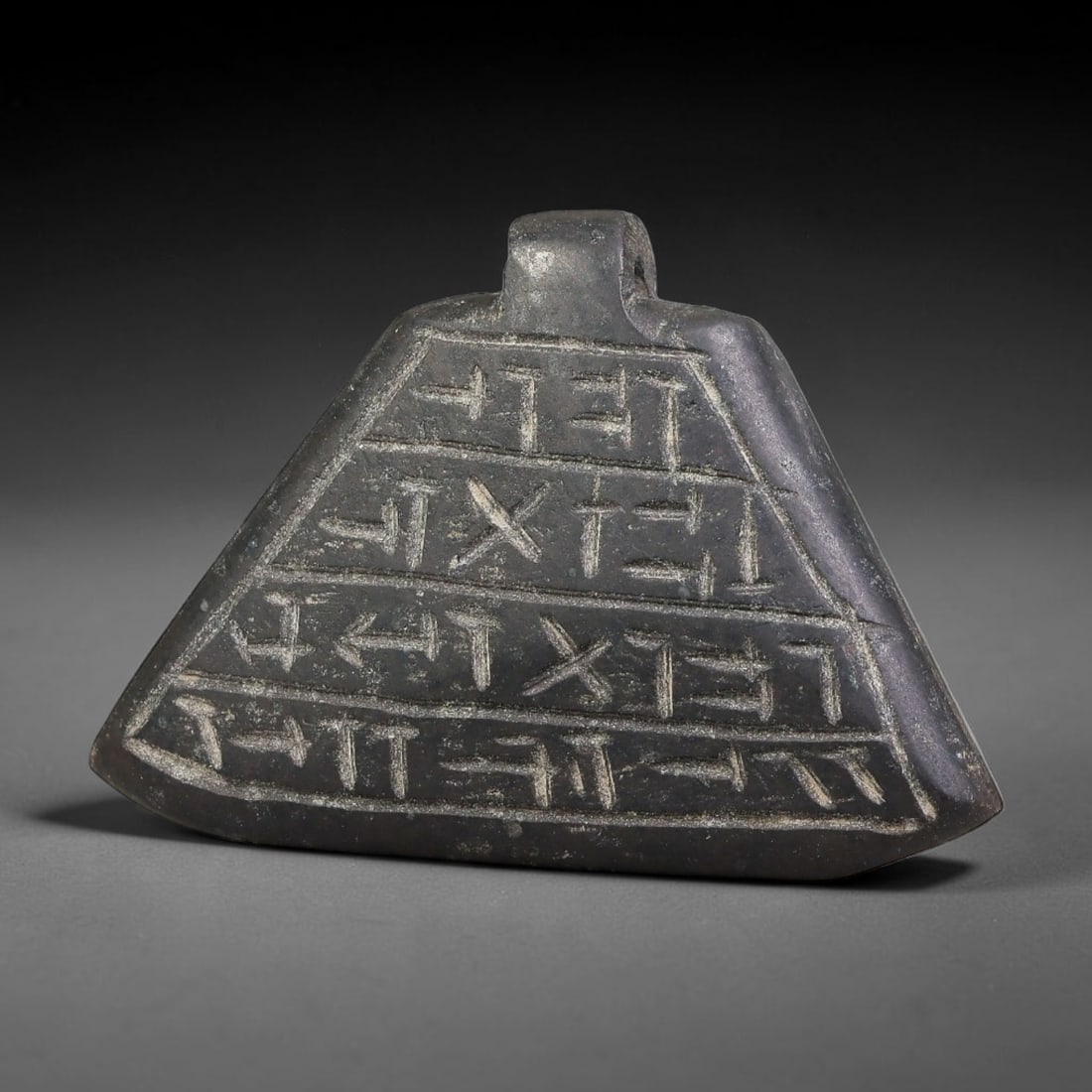 Vintage Uruk Revival Carved Stone Cuneiform Talisman Pendant Plaque, 41FL: This vintage pendant is hand-carved from dark mineral stone, designed in revival style inspired by ancient Uruk glyptic traditions. The surface features neatly arranged horizontal bands of stylized cu