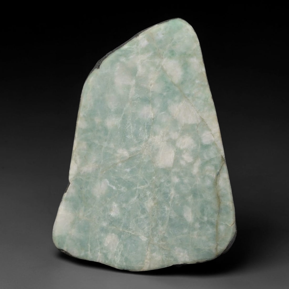 370ct Natural Type A Burmese Jadeite Jade Sliced Rough, 32AZ: This specimen is a sliced rough block of natural Type A Burmese jadeite jade. The interior displays natural colour zoning with visible mineral veining and crystalline patterns typical of unprocessed j