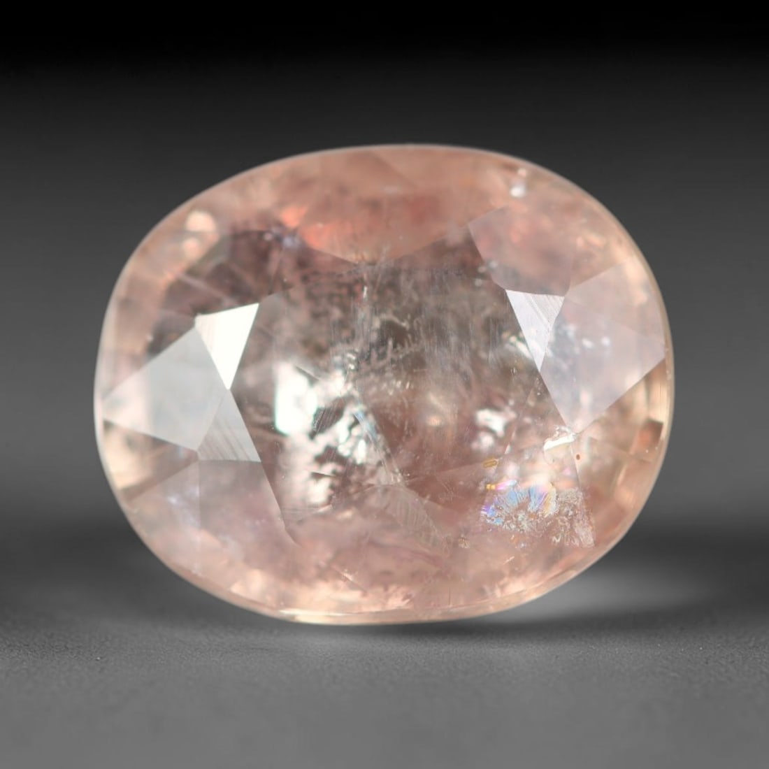 2.15ct Natural Sri Lankan Padparadscha Sapphire Loose Gemstone, 63BC: This fully polished Padparadscha sapphire carries warm blended peach-pink and soft orange body saturation, with subtle microscopic mineral flecks dispersed within its crystalline interior across its c