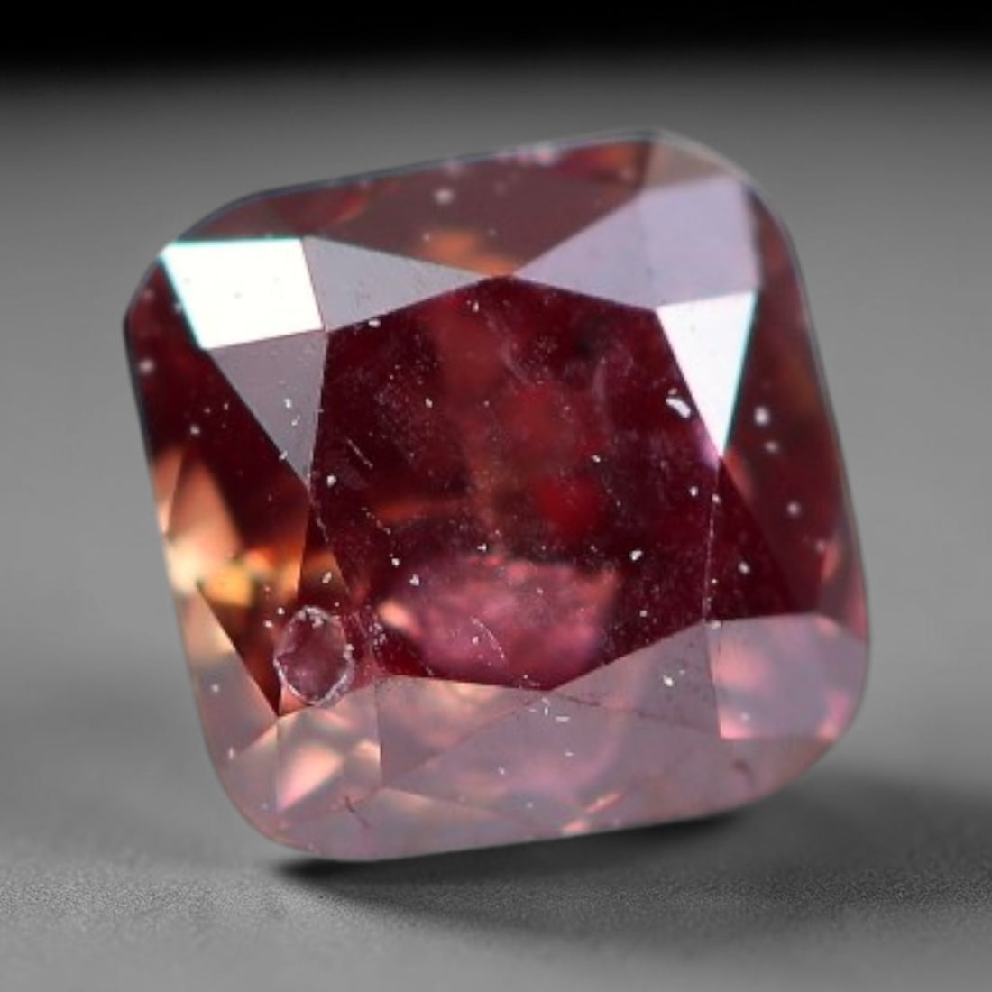 0.16ct Natural Fancy Pinkish Purple Diamond Loose Gemstone, 13BH: This polished natural diamond displays rich pinkish-purple body saturation, with subtle fine microscopic mineral specks distributed within its crystal interior, measured at calibrated dimensions of 2.