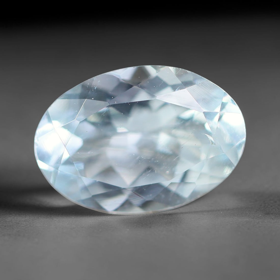 1.86ct Natural Brazilian Sky Blue Faceted Aquamarine Loose Gemstone, 13BF: This precisely faceted aquamarine boasts clear translucent pale sky blue body tone with subtle thin mineral needle and tiny scattered crystalline specks visible within its polished reflective planes i