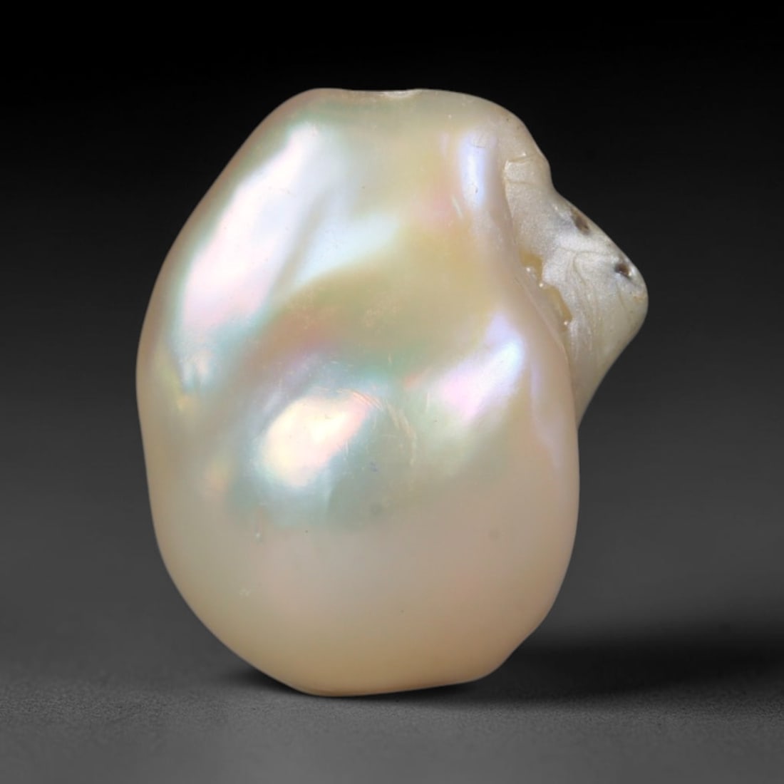 Natural Freshwater Keshi Pearl - Iridescent Baroque Pearl Ornament, 54AE: A natural freshwater keshi pearl with organic asymmetrical baroque shaping, exhibiting soft creamy blush base tones with shifting pastel pink, lavender and pale gold iridescent luster across its smoot