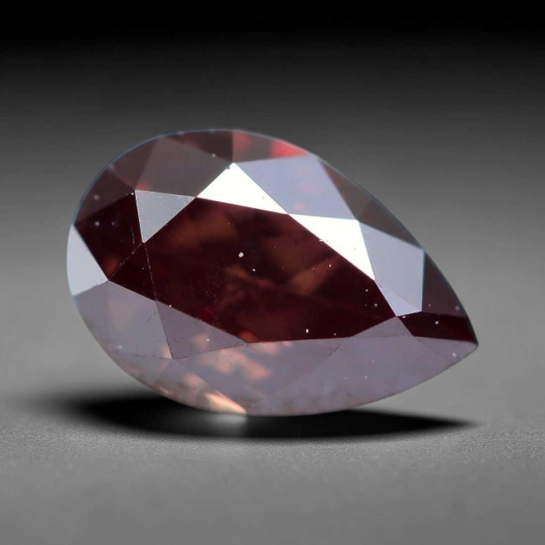 0.37ct Natural Fancy Pinkish Purple Diamond Loose Gemstone, 10BH: This polished natural diamond displays rich pinkish-purple body saturation, with subtle fine microscopic mineral specks distributed within its crystal interior, measured at calibrated dimensions of 5.