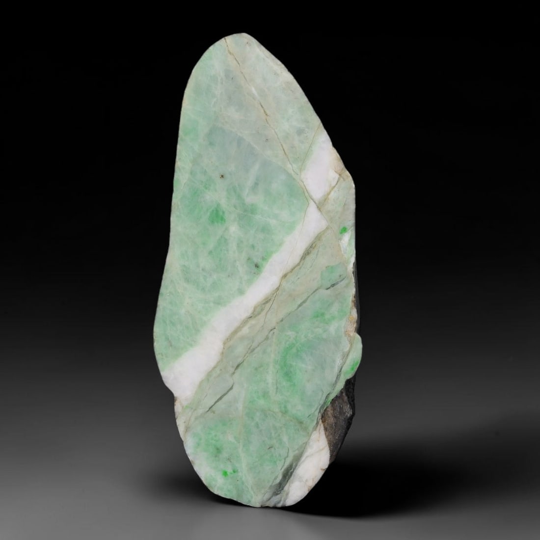 222ct Natural Type A Burmese Jadeite Jade Sliced Rough, 64AZ: This specimen is a sliced rough block of natural Type A Burmese jadeite jade. The interior displays natural colour zoning with visible mineral veining and crystalline patterns typical of unprocessed j