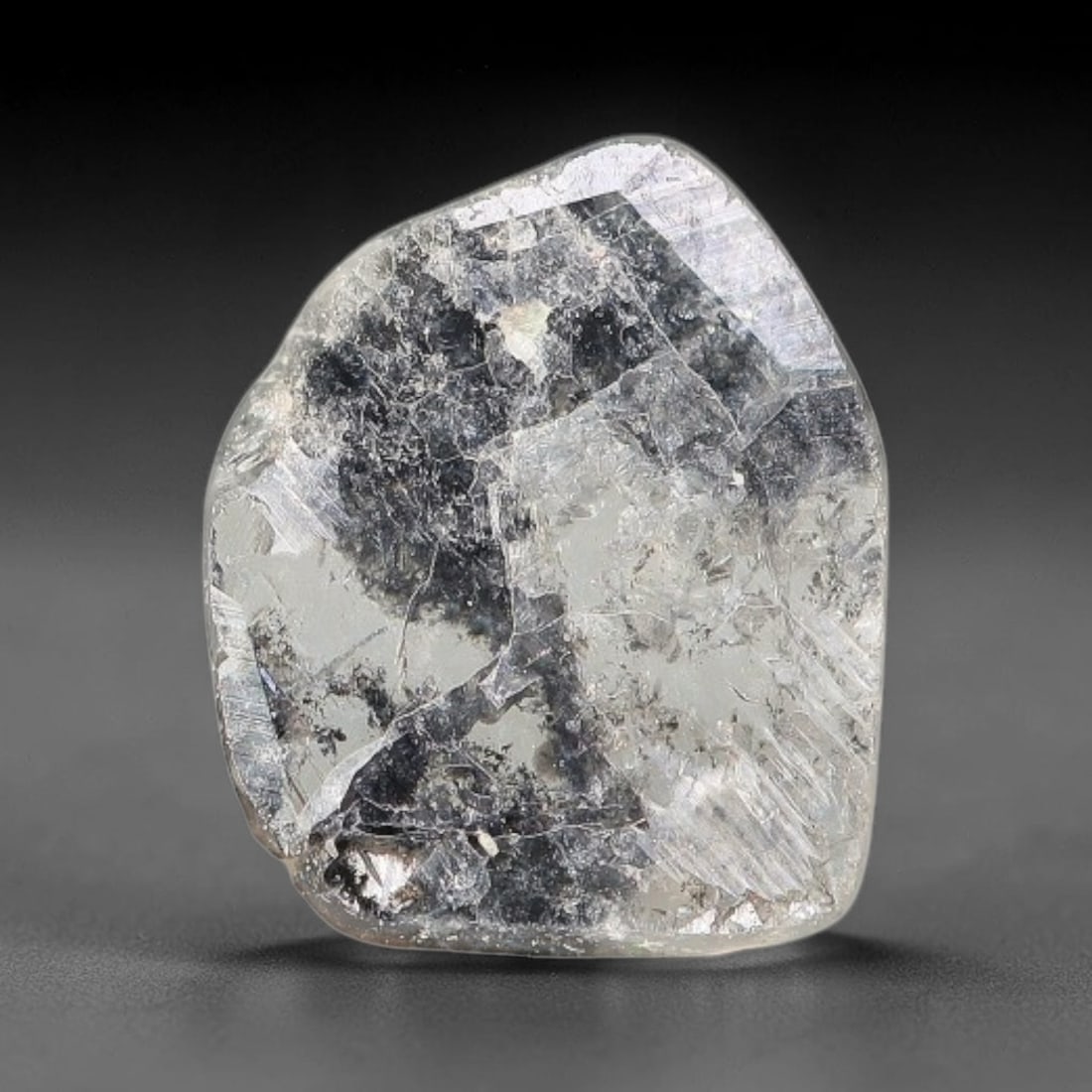 0.33ct Natural Fancy Diamond Slice, 67BG: This unique natural diamond slice features a delicate hand-executed rose cut surface, showcasing captivating pictorial mineral inclusions trapped within the diamond matrix. Measuring 6.4x5.3x0.6mm, th
