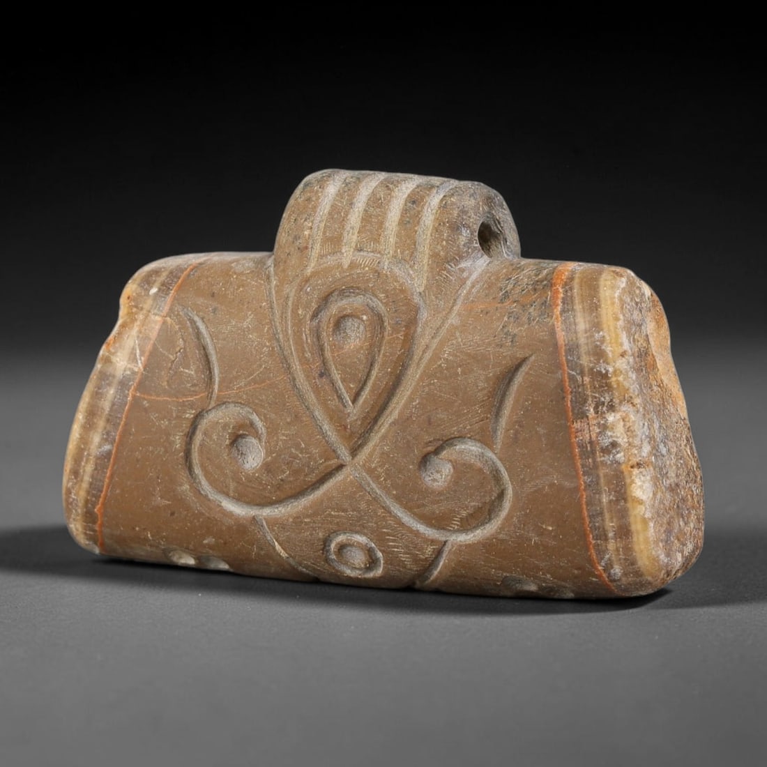 Antique Nishapur Era Silk Road Carved Banded Stone Talisman Amulet Pendant, 90FK: This antique carved stone amulet originates from the artistic traditions of the Nishapur period on the historic Silk Road. Crafted from natural banded stone, its surface is decorated with elegantly in