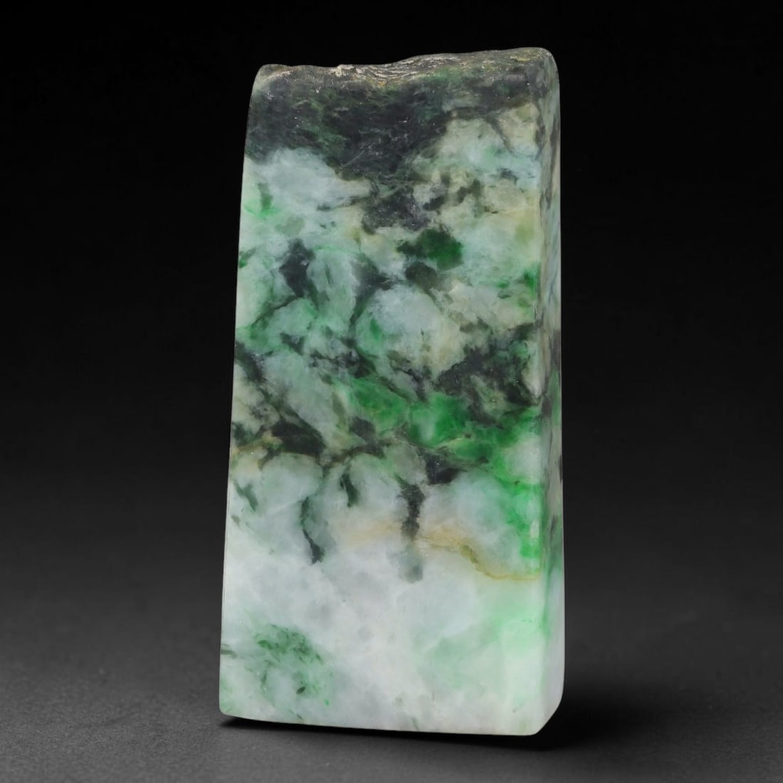 360ct Natural Type A Burmese Jadeite Jade Sliced Rough, 98FA: This specimen is a sliced rough block of natural Type A Burmese jadeite jade. The interior displays natural colour zoning with visible mineral veining and crystalline patterns typical of unprocessed j