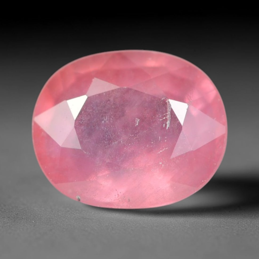 1.20ct Natural Sri Lankan Padparadscha Sapphire Loose Gemstone, 54BC: This fully polished Padparadscha sapphire carries warm blended peach-pink and soft orange body saturation, with subtle microscopic mineral flecks dispersed within its crystalline interior across its c
