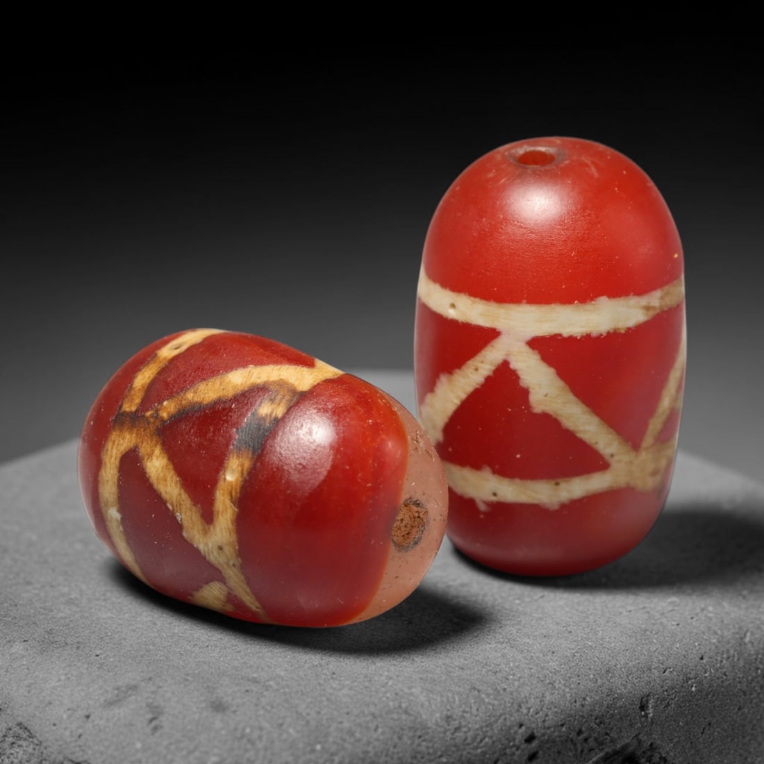 Ancient Medieval Burmese Pagan & Ava Kingdoms Etched Carnelian Barrel Beads (849-1555 CE), 42FY: This pair of antique etched carnelian barrel beads originates from the Medieval Burmese Pagan & Ava Kingdoms, whose etched carnelian bead craft continued to produce trade specimens circulated widely t
