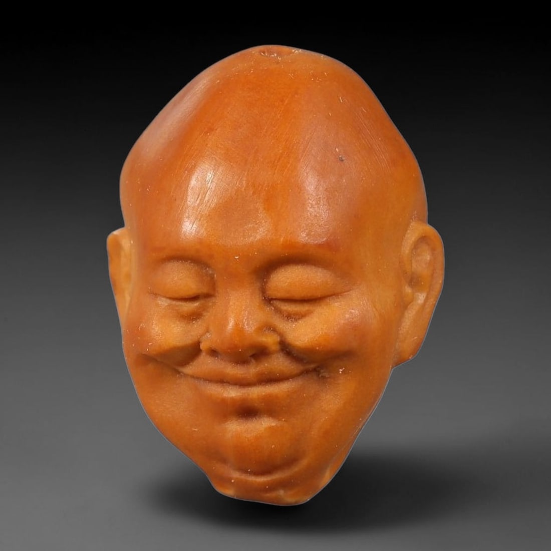 A Chinese Carved Natural Olive Nut Drilled Art Bead, 51BZ: Traditional craft bead carved from solid natural olive nut core, representing a classic miniature Chinese micro-carving folk art piece with a pre-drilled suspension bore integrated for easy threading 