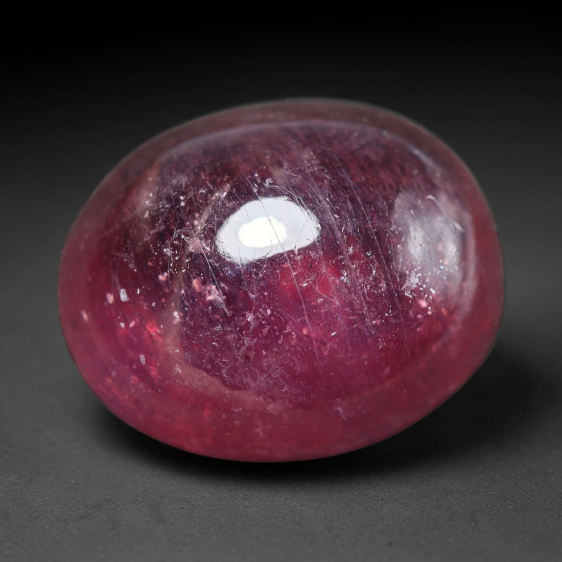 16.73ct Natural Madagascar Ruby Oval Cabochon Loose Gemstone, 28BY: This smoothly polished oval cabochon is natural ruby originating from Madagascar. It exhibits rich deep red colouration throughout the crystal matrix, with visible natural mineral veining, fine crysta