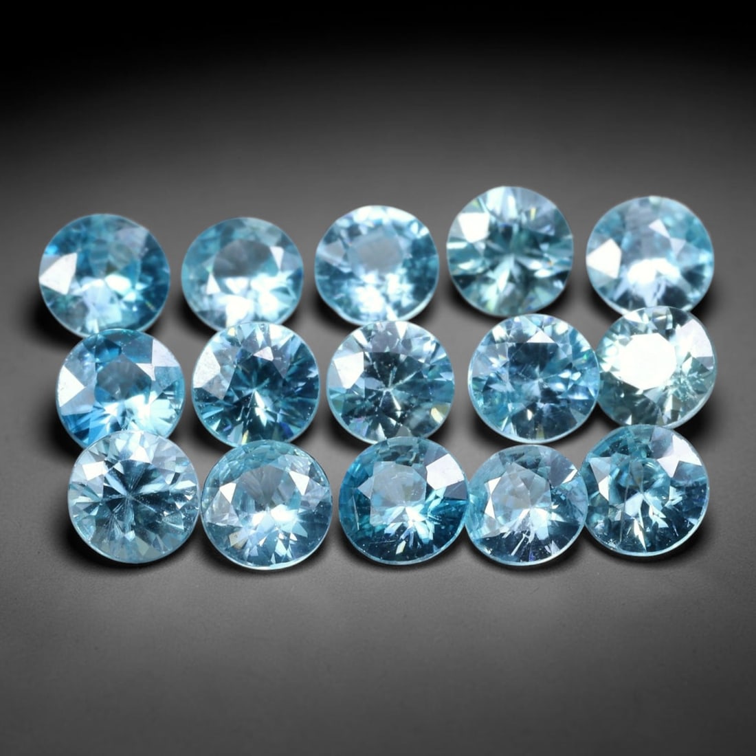 5.34ct Parcel of 15pcs Natural Brazilian Calibrated Round Sky Blue Topaz Loose Gemstones, 33BE: This matched parcel contains 15 polished calibrated round topaz displaying clean bright sky-blue hue, with faint minor natural internal crystal features within each gemstone, uniform calibrated size o