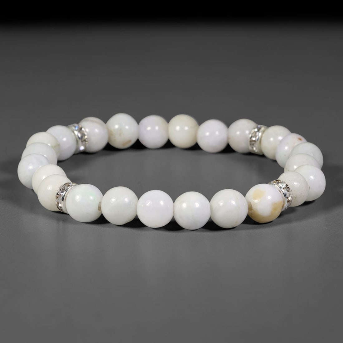 Natural Burmese Type A Jadeite Jade Beaded Bracelet, 28FJ: Made with polished natural jadeite jade round beads featuring soft pale natural tones. Each bead measures 9mm, strung as a flexible stretch bracelet. A minimalist elegant design ideal for daily wear, 