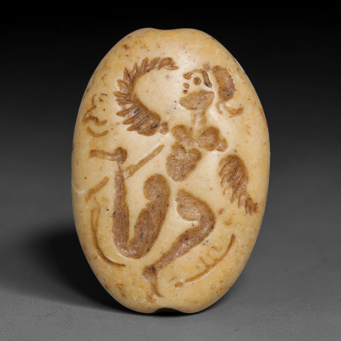 Ancient Sasanian Persian Intaglio Bead (224-651 CE), 90EC: This antique intaglio bead originates from the Sasanian Persian Empire, famous for carved stone beads worn as protective talismans and personal emblems across late antique Persia. The pale cream stone