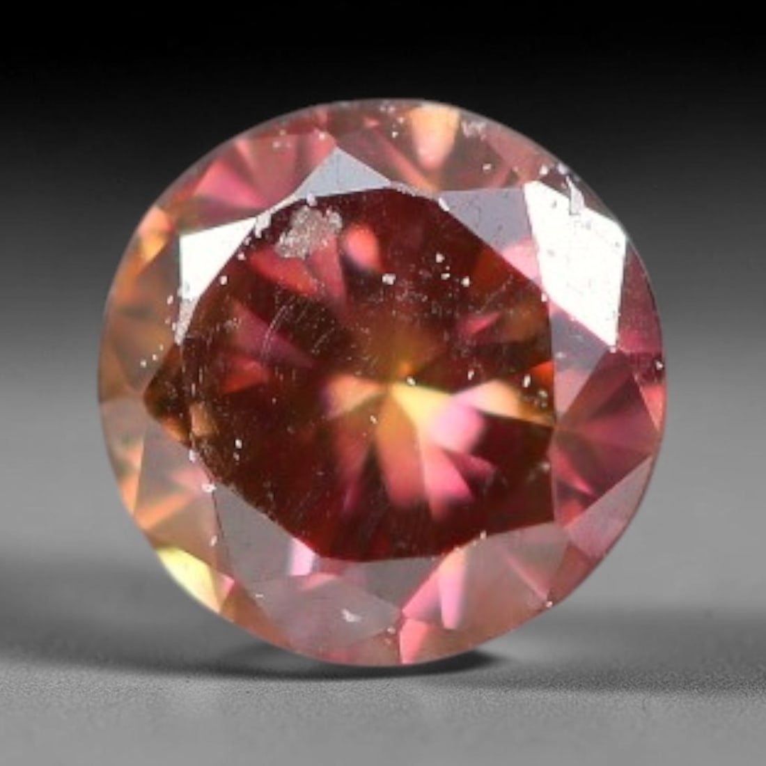 0.07ct Natural Fancy Pinkish Purple Diamond Loose Gemstone, 1BH: This polished natural diamond displays rich pinkish-purple body saturation, with subtle fine microscopic mineral specks distributed within its crystal interior, measured at calibrated dimensions of 2.