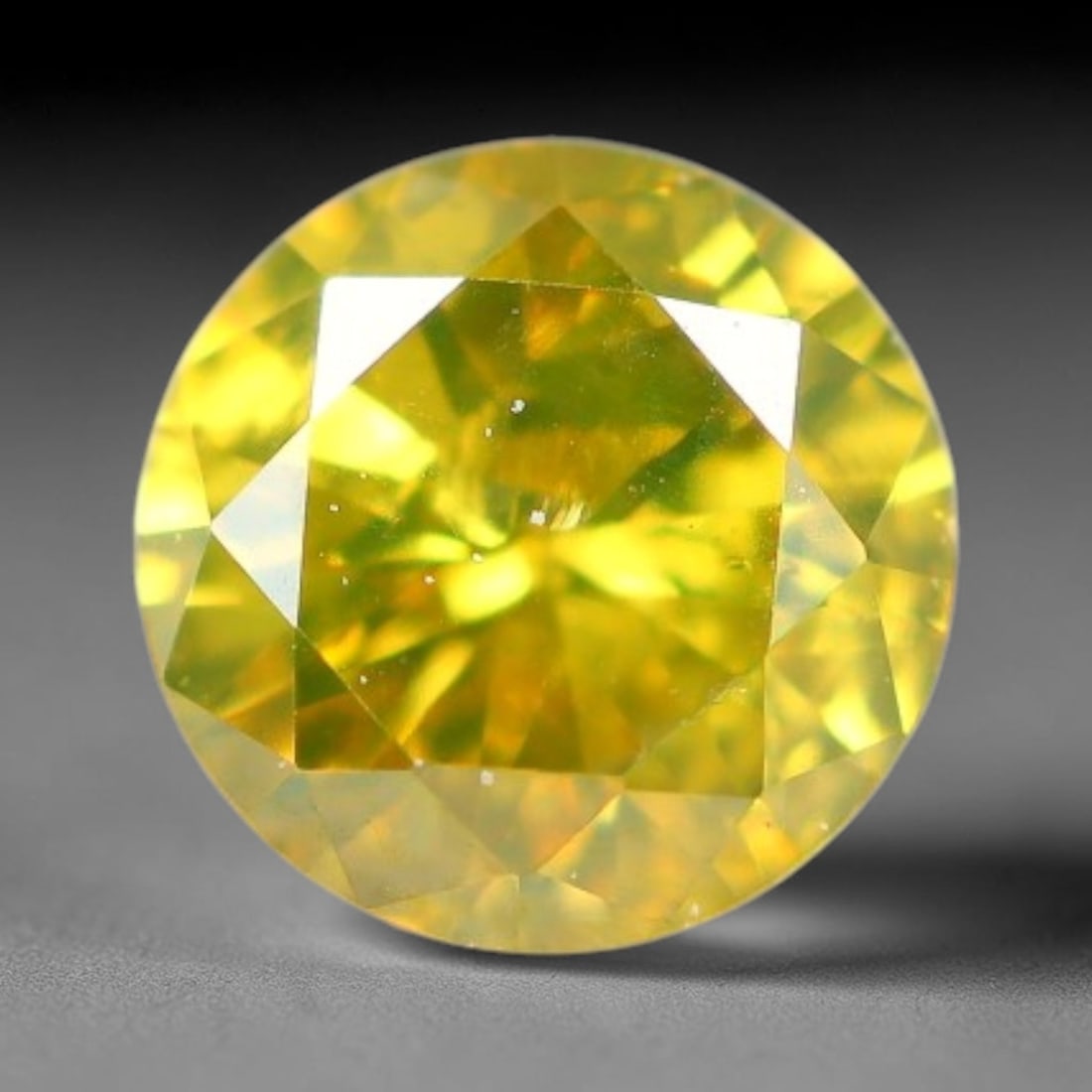 0.18ct Round Natural Fancy Vivid Yellow Diamond Loose Gemstone, 4BH: This polished natural round fancy diamond exhibits vibrant saturated yellow colour, with fine microscopic native mineral specks visible inside the crystal, measured at calibrated dimensions of 3.6x2.2