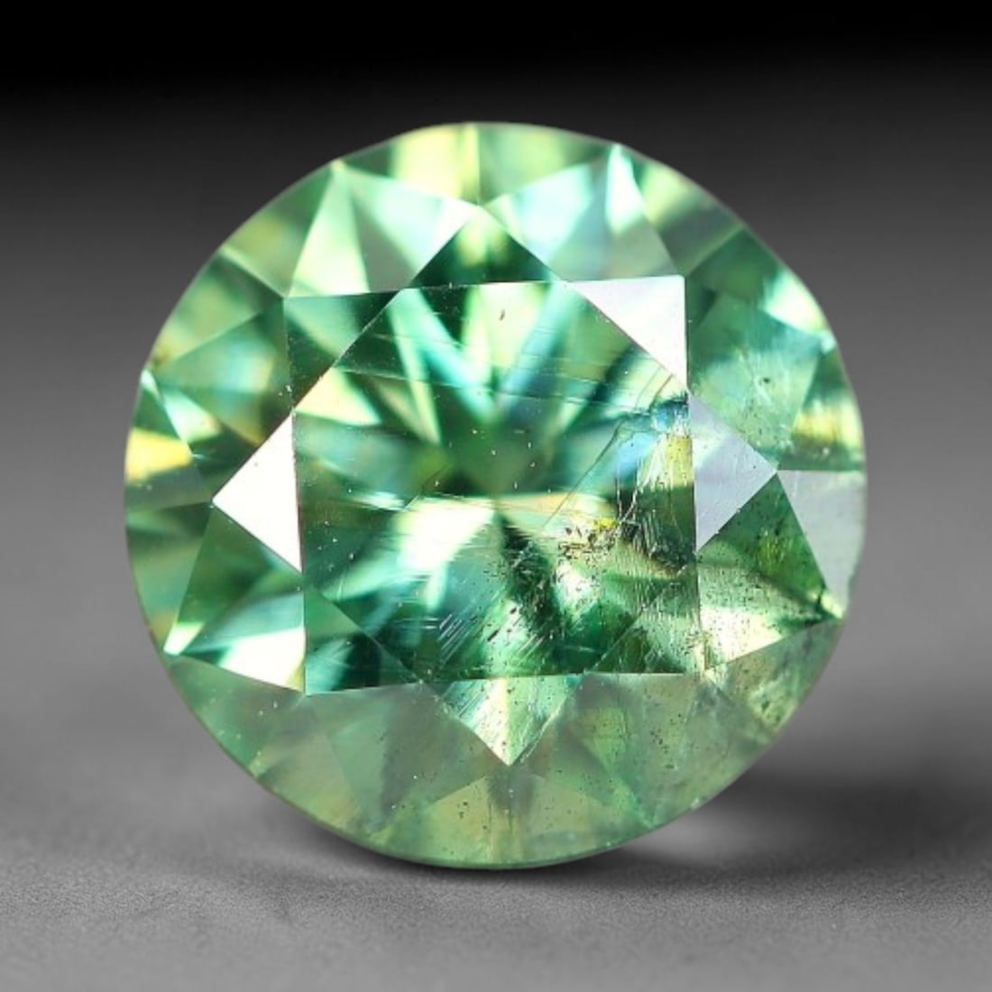 1.02 Carats Natural Teal Green Moissanite Loose Gemstone, 34FP: This lab-grown teal green moissanite measures 6.5x4.1mm, composed of silicon carbide with an outstanding refractive index that yields vivid, multi-hued sparkle in all lighting. Fine natural micro crys