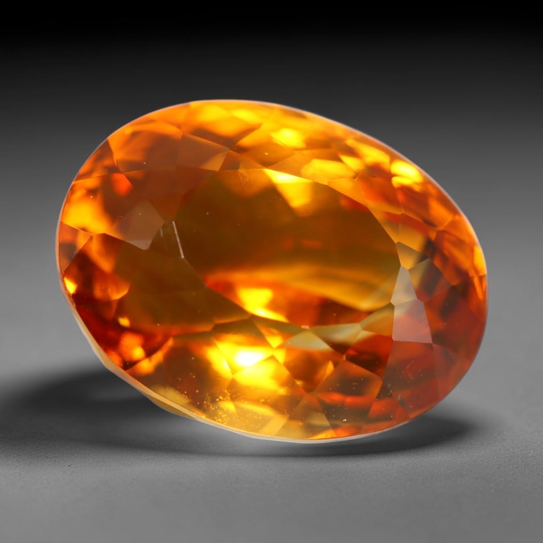 8.38ct Natural Brazilian Madeira Citrine Oval Faceted Loose Gemstone, 81BZ: This expertly cut oval faceted gemstone is natural Madeira citrine sourced from Brazil. It exhibits rich, saturated deep golden-orange tone characteristic of premium Madeira citrine, with crisp facets