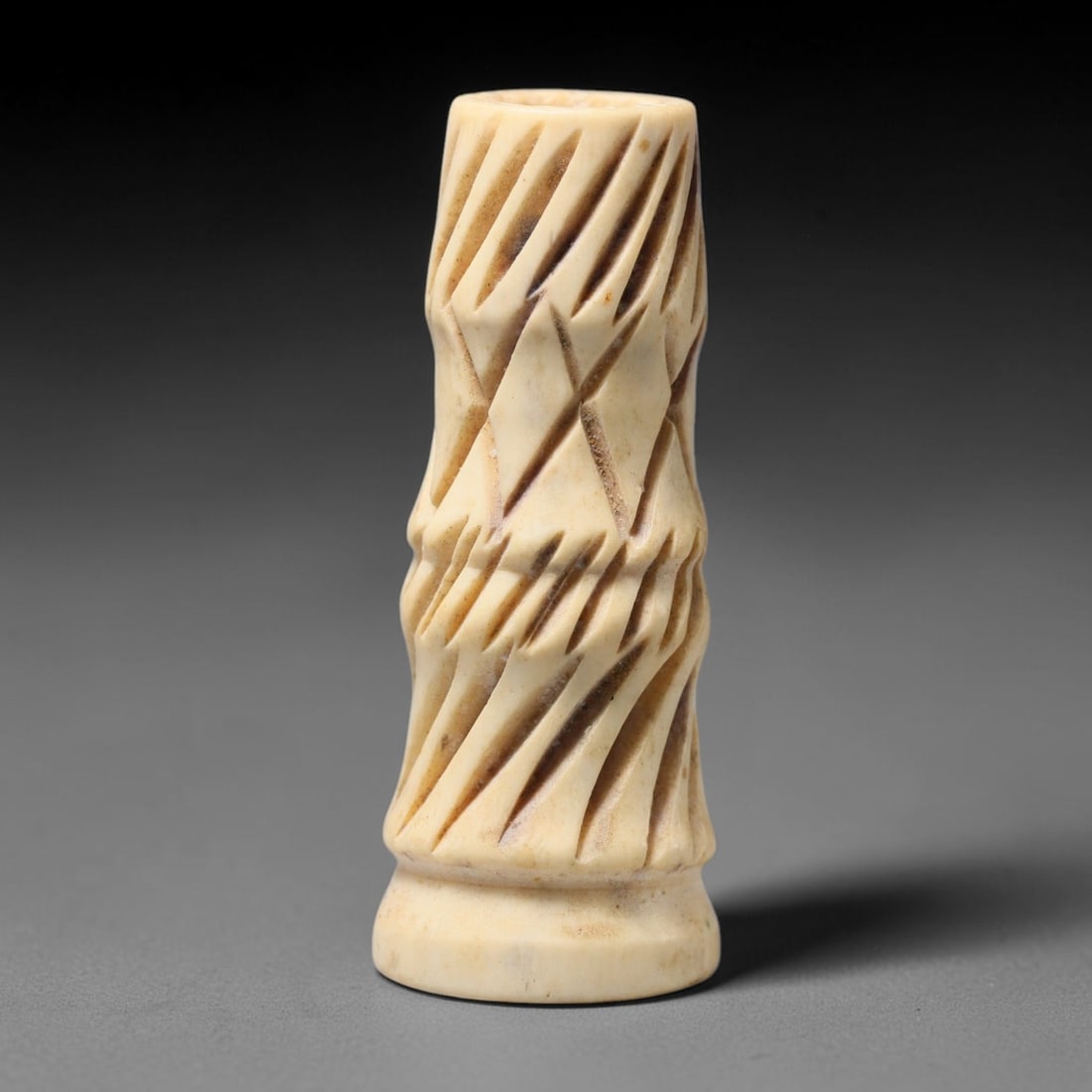 Antique Sino-Siberian Steppe Nomadic Craft Stag Antler Carved Cylinder Bead (Post 1850s), 72FV: Single bead carved from natural stag antler, originating from Sino-Siberian Steppe Nomadic craft traditions, post 1850s. Measuring 5x2cm, the piece features detailed surface carving and carries warm n