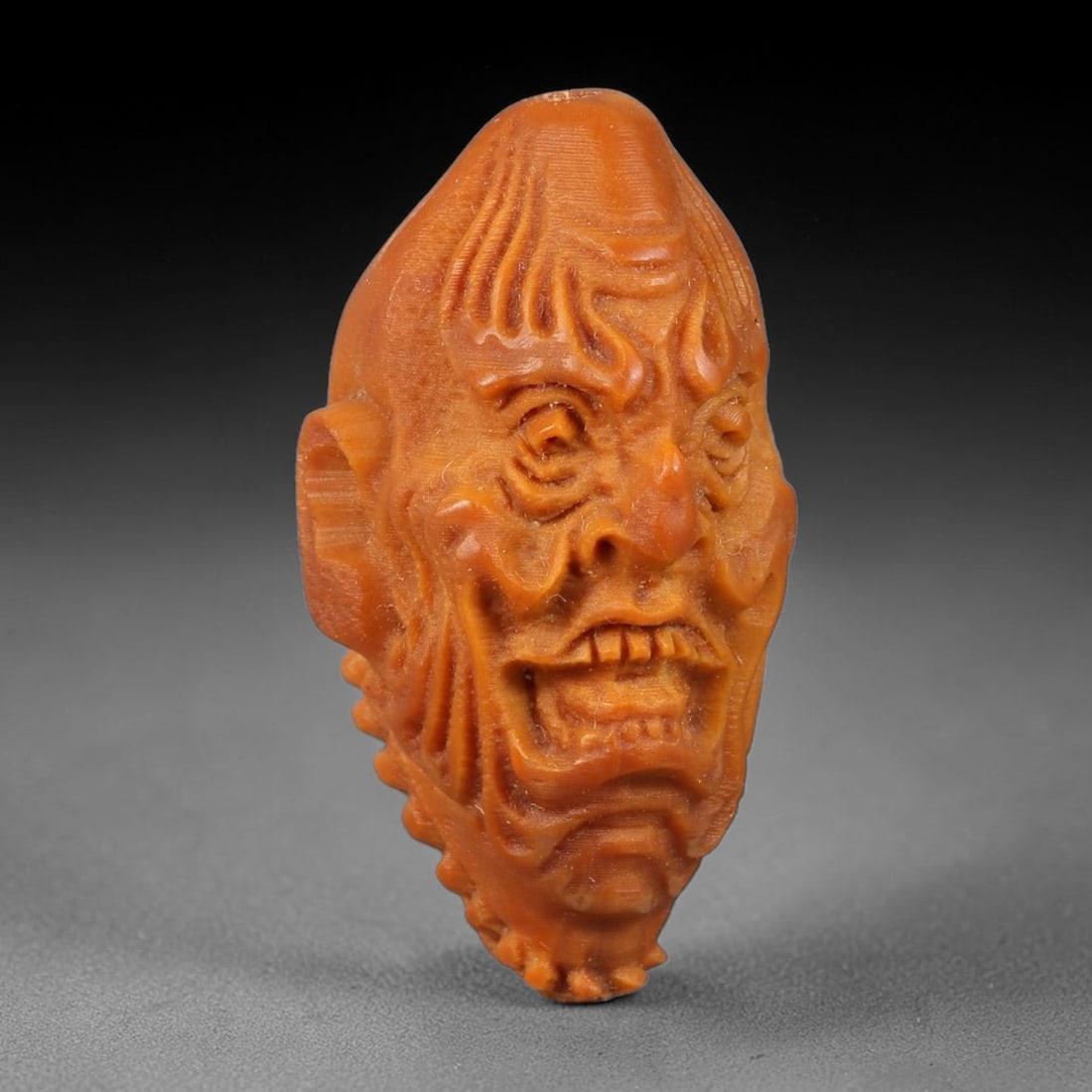 A Chinese Carved Natural Olive Nut Drilled Art Bead, 19BZ: Traditional craft bead carved from solid natural olive nut core, representing a classic miniature Chinese micro-carving folk art piece with a pre-drilled suspension bore integrated for easy threading 