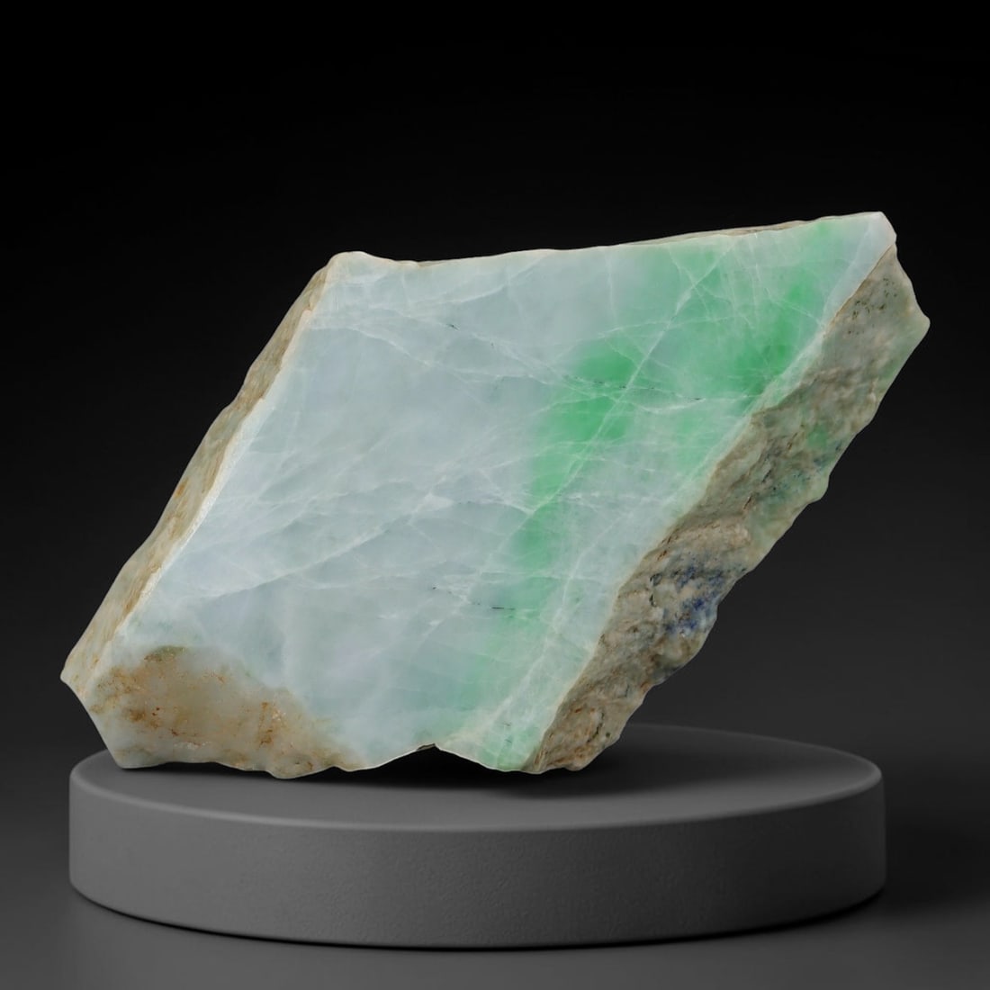 320ct Natural Type A Burmese Jadeite Jade Sliced Rough, 52AZ: This specimen is a sliced rough block of natural Type A Burmese jadeite jade. The interior displays natural colour zoning with visible mineral veining and crystalline patterns typical of unprocessed j