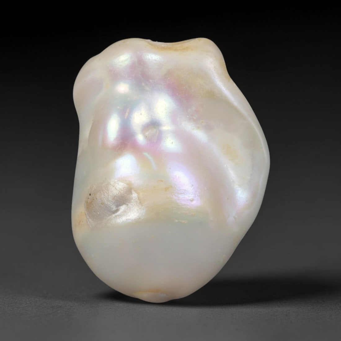 Natural Freshwater Keshi Pearl - Iridescent Baroque Pearl Ornament, 63AE: A natural freshwater keshi pearl with organic asymmetrical baroque shaping, exhibiting soft creamy blush base tones with shifting pastel pink, lavender and pale gold iridescent luster across its smoot