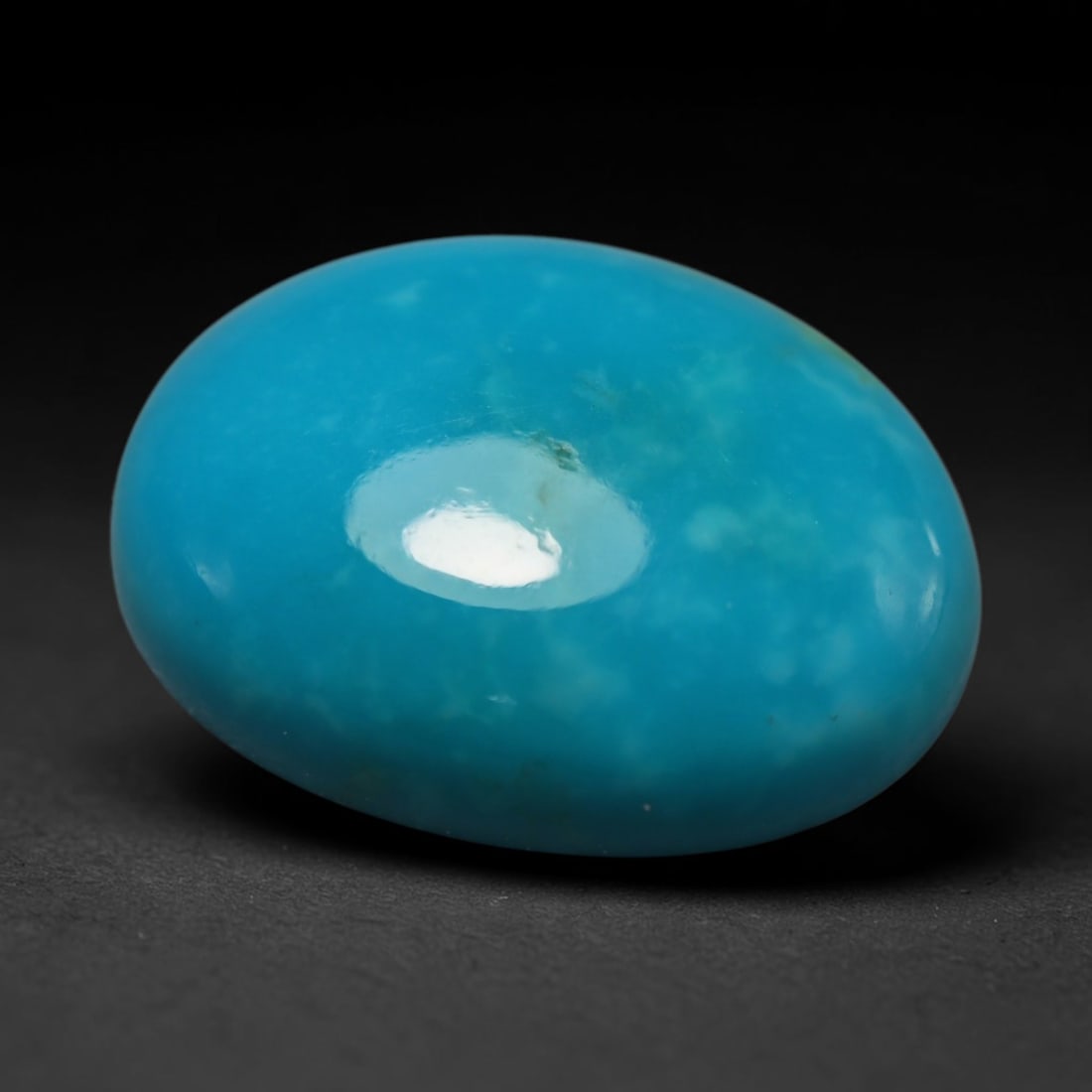 7.03ct Natural Sleeping Beauty Turquoise Oval Cabochon Loose Gemstone, 70BZ: This smoothly polished oval cabochon is authentic Sleeping Beauty turquoise originating from Arizona, USA. It displays the coveted uniform vibrant sky-blue hue characteristic of premium Sleeping Beaut