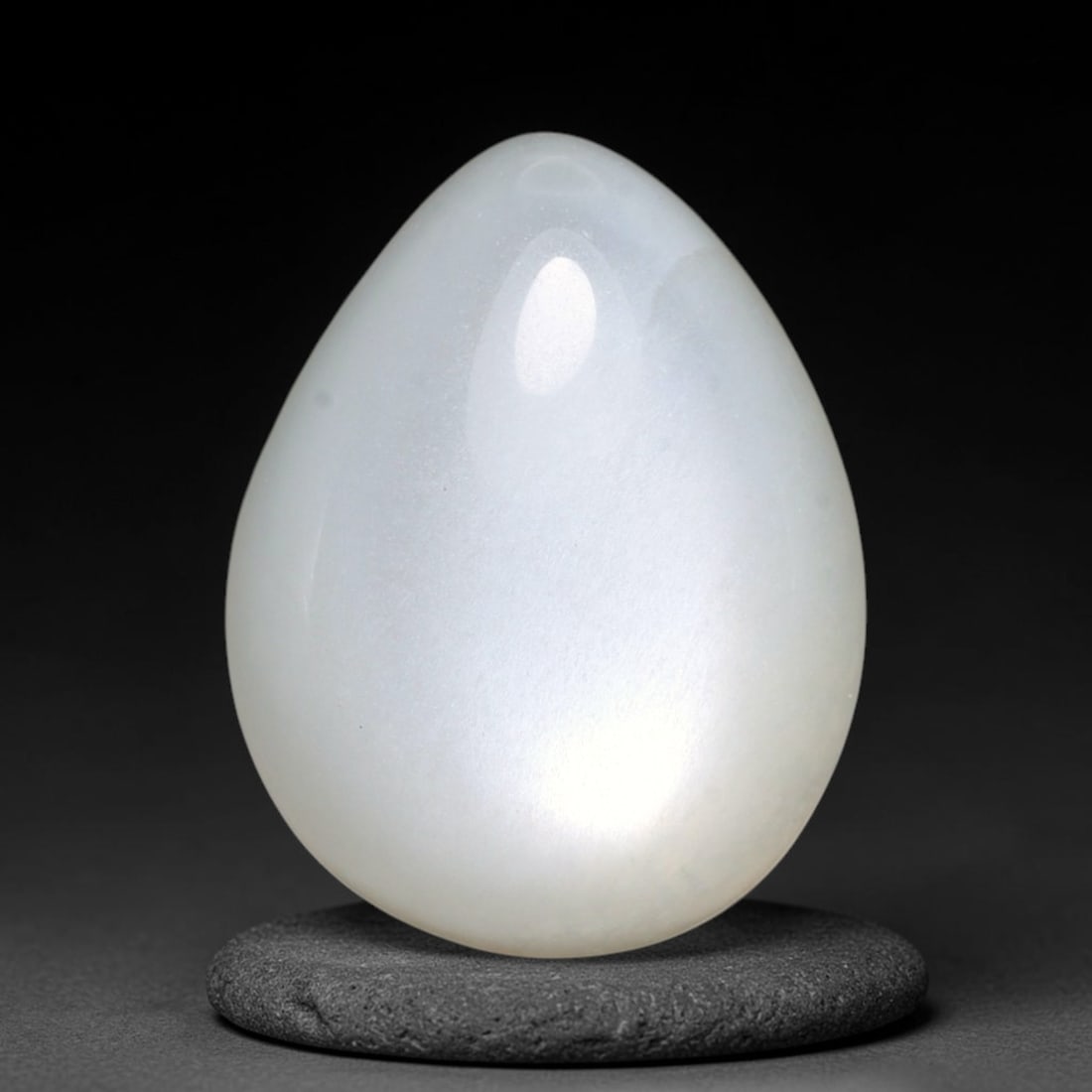 14.56ct Natural Ceylon White Moonstone Cabochon Loose Gemstone, 9FY: This natural Ceylon moonstone cabochon carries a milky white body showcasing classic adularescence. Fine mineral inclusions are visible within the gem. Dimensions measure 17x14x7mm, mined in Sri Lanka